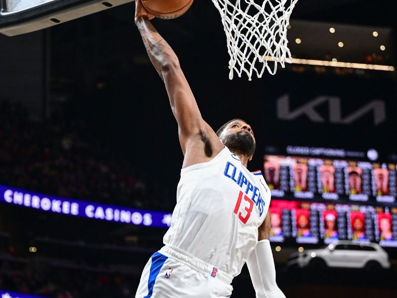 ATLANTA, GA - JANUARY 28: Paul George #13 of the LA Clippers drives to the basket during the game on January 28, 2023 at State Farm Arena in Atlanta, Georgia.  NOTE TO USER: User expressly acknowledges and agrees that, by downloading and/or using this Photograph, user is consenting to the terms and conditions of the Getty Images License Agreement. Mandatory Copyright Notice: Copyright 2023 NBAE (Photo by Adam Hagy/NBAE via Getty Images)