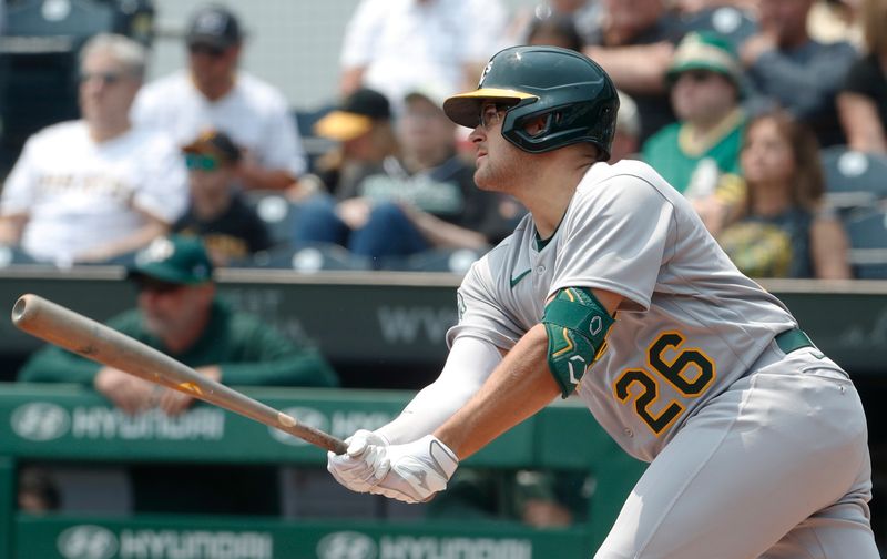 Jun 7, 2023; Pittsburgh, Pennsylvania, USA;  Oakland Athletics third baseman Jonah Bride (26) hits an RBI single against the Pittsburgh Pirates during the first inning at PNC Park. Mandatory Credit: Charles LeClaire-USA TODAY Sports