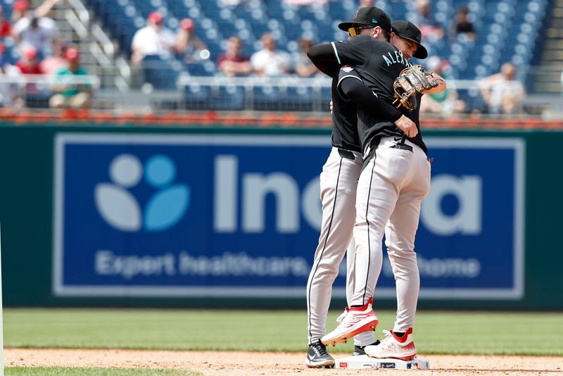 Jun 20, 2024; Washington, District of Columbia, USA; Arizona Diamondbacks shortstop Blaze Alexander (9) hugs Diamondbacks shortstop Kevin Newman (18) after their game against the Washington Nationals at Nationals Park. Mandatory Credit: Geoff Burke-USA TODAY Sports