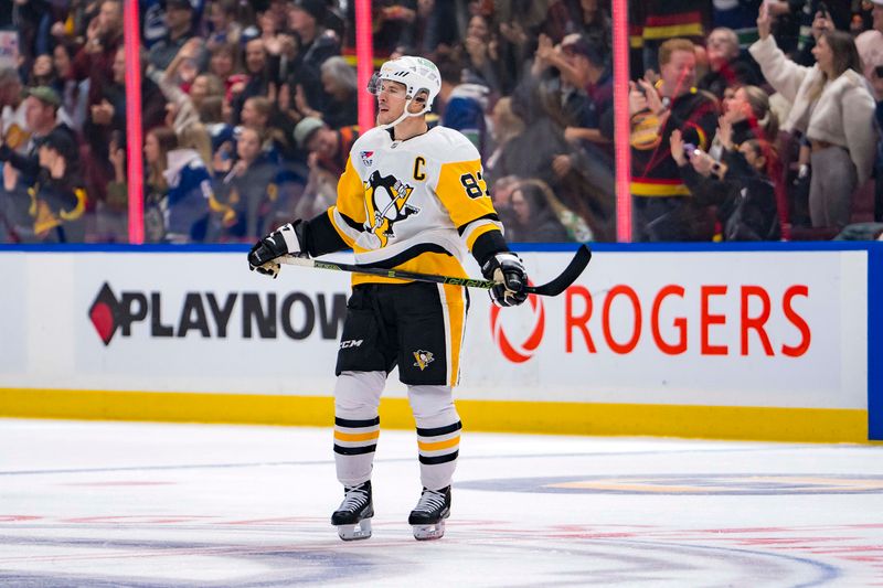 Oct 26, 2024; Vancouver, British Columbia, CAN; Pittsburgh Penguins forward Sidney Crosby (87) reacts after Vancouver Canucks forward J.T. Miller (9) scored during the second period at Rogers Arena. Mandatory Credit: Bob Frid-Imagn Images