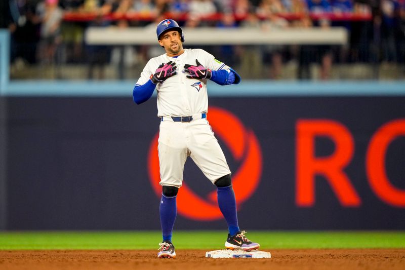 Jun 29, 2024; Toronto, Ontario, CAN; Toronto Blue Jays outfielder George Springer (4) celebrates hitting a double against the New York Yankees during the sixth inning at Rogers Centre. Mandatory Credit: Kevin Sousa-USA TODAY Sports