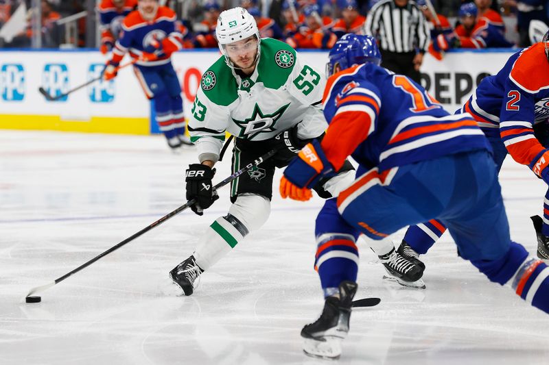 Jun 2, 2024; Edmonton, Alberta, CAN; Dallas Stars forward Wyatt Johnson (53) takes a shot in front of Edmonton Oilers defensemen Mattias Ekholm (14) during the second period in game six of the Western Conference Final of the 2024 Stanley Cup Playoffs at Rogers Place. Mandatory Credit: Perry Nelson-USA TODAY Sports