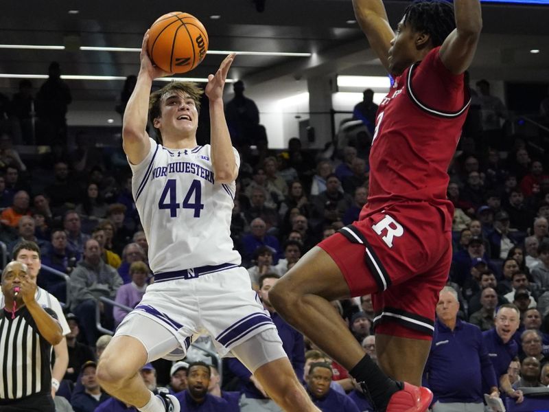 Jan 29, 2025; Evanston, Illinois, USA; Rutgers Scarlet Knights forward Dylan Grant (9) defends Northwestern Wildcats guard Angelo Ciaravino (44) during the second half at Welsh-Ryan Arena. Mandatory Credit: David Banks-Imagn Images