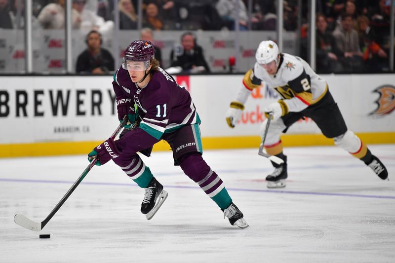 Dec 27, 2023; Anaheim, California, USA; Anaheim Ducks center Trevor Zegras (11) moves in for a shot on goal against the Vegas Golden Knights during the third period at Honda Center. Mandatory Credit: Gary A. Vasquez-USA TODAY Sports