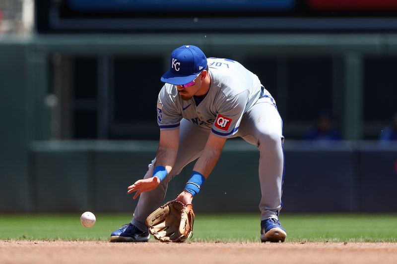 May 30, 2024; Minneapolis, Minnesota, USA; Kansas City Royals second baseman Nick Loftin (12) fields the ball hit by Minnesota Twins Willi Castro (50) during the second inning at Target Field. Mandatory Credit: Matt Krohn-USA TODAY Sports