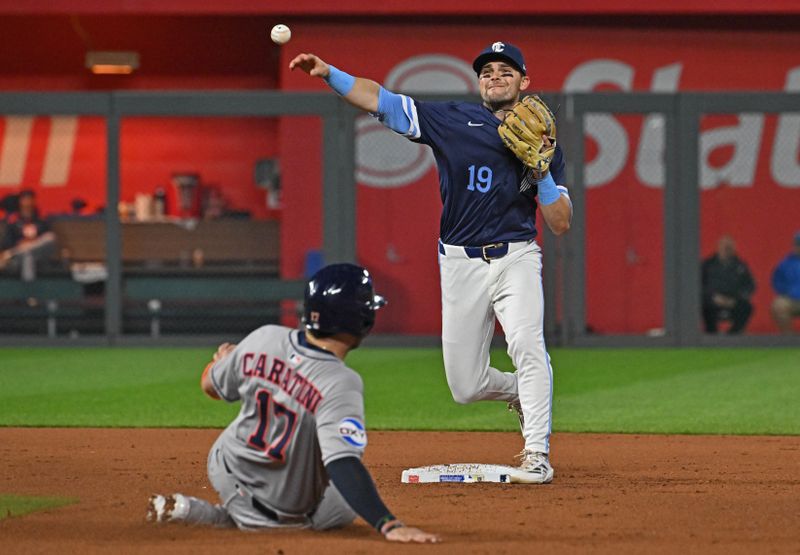 Apr 25, 2025; Kansas City, Missouri, USA;  Kansas City Royals second baseman Michael Massey (19) throws to first base for a double play over Houston Astros catcher Victor Caratini (17) in the eighth inning at Kauffman Stadium. Mandatory Credit: Peter Aiken-Imagn Images