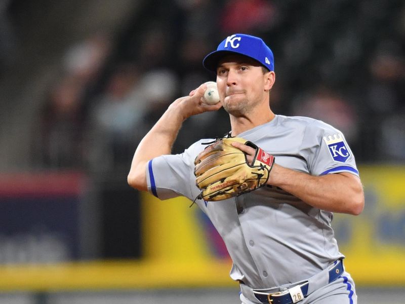 Apr 15, 2024; Chicago, Illinois, USA; Kansas City Royals second baseman Adam Frazier (26) completes a double play after forcing out Chicago White Sox left fielder Andrew Benintendi (23) during the sixth inning at Guaranteed Rate Field. Mandatory Credit: Patrick Gorski-USA TODAY Sports