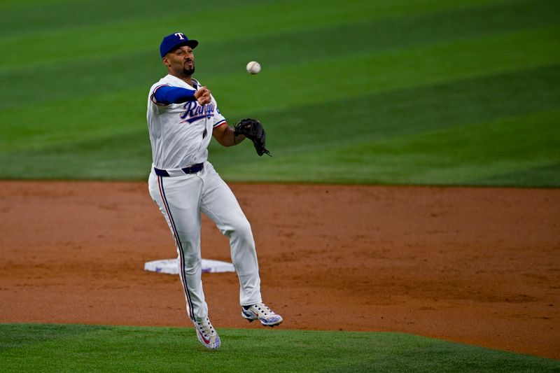 Aug 7, 2024; Arlington, Texas, USA;  Texas Rangers second baseman Marcus Semien (2) throws to first base during the second inning against the Houston Astros at Globe Life Field. Mandatory Credit: Jerome Miron-USA TODAY Sports