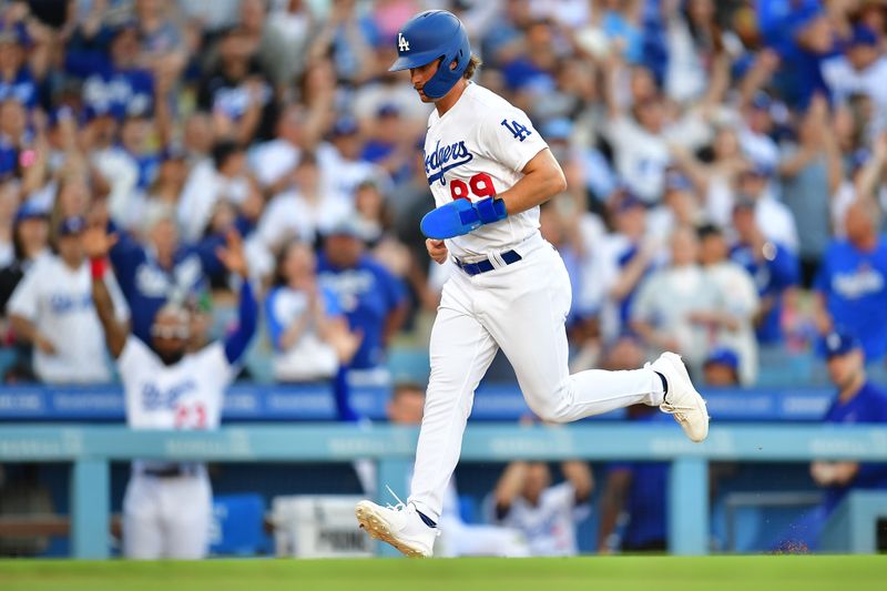 Jun 24, 2023; Los Angeles, California, USA; Los Angeles Dodgers pinch runner Jonny Deluca (89) scores a run on a balk commited by Houston Astros relief pitcher Ryne Stanek (45) during the eighth inning at Dodger Stadium. Mandatory Credit: Gary A. Vasquez-USA TODAY Sports