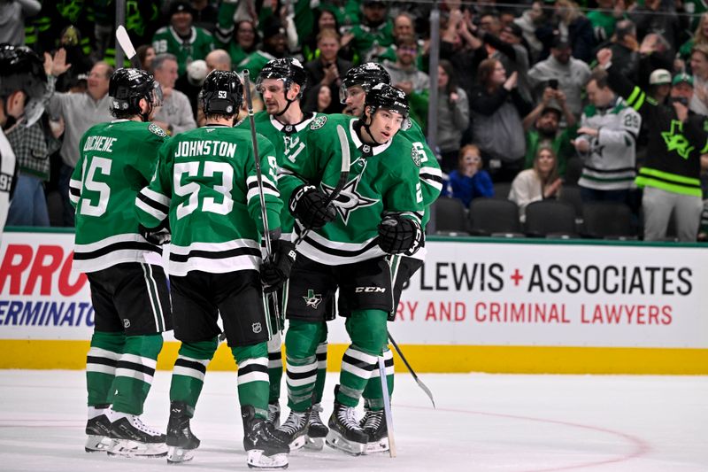 Jan 31, 2025; Dallas, Texas, USA; Dallas Stars left wing Jason Robertson (21) and center Wyatt Johnston (53) and center Roope Hintz (24) and center Matt Duchene (95) celebrates a power play goal scored by Robertson against the Vancouver Canucks during the second period at the American Airlines Center. Mandatory Credit: Jerome Miron-Imagn Images