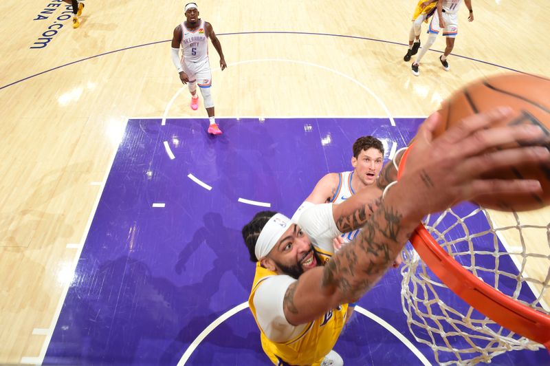 LOS ANGELES, CA - MARCH 4: Anthony Davis #3 of the Los Angeles Lakers dunks the ball during the game against the Oklahoma City Thunder on March 4, 2024 at Crypto.Com Arena in Los Angeles, California. NOTE TO USER: User expressly acknowledges and agrees that, by downloading and/or using this Photograph, user is consenting to the terms and conditions of the Getty Images License Agreement. Mandatory Copyright Notice: Copyright 2024 NBAE (Photo by Andrew D. Bernstein/NBAE via Getty Images)