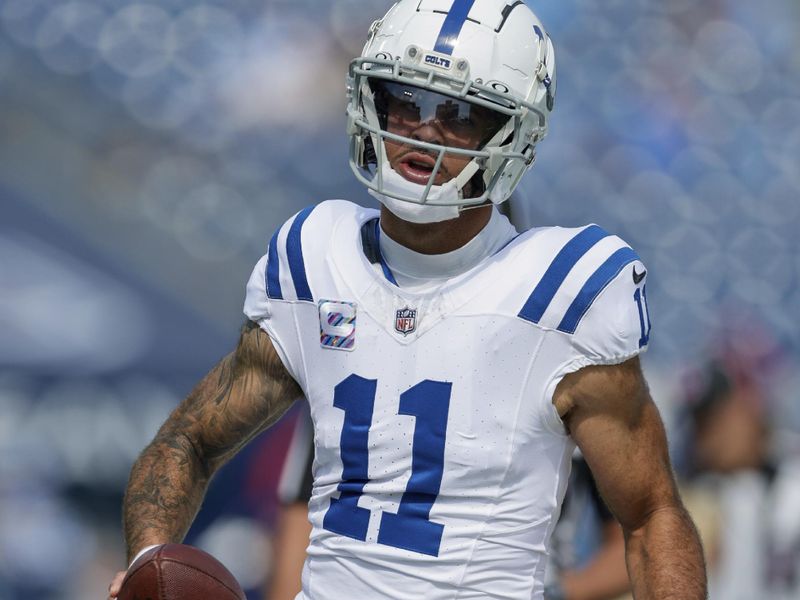 Indianapolis Colts wide receiver Michael Pittman Jr. (11) warms up prior to an NFL football game against the Tennessee Titans, Sunday, Oct. 13, 2024, in Nashville, Tenn. (AP Photo/Stew Milne)