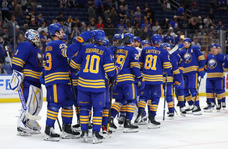 Sep 21, 2024; Buffalo, New York, USA;  The Buffalo Sabres celebrate a win over the Pittsburgh Penguins at KeyBank Center. Mandatory Credit: Timothy T. Ludwig-Imagn Images