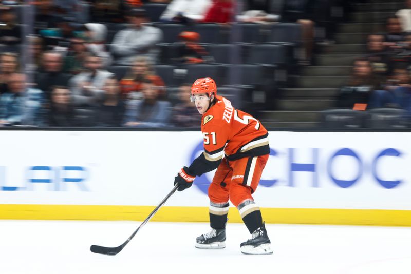 Nov 8, 2024; Anaheim, California, USA;Anaheim Ducks defenseman Olen Zellweger (51) skates with the puck during the third period of a hockey game against the Minnesota Wild at Honda Center. Mandatory Credit: Jessica Alcheh-Imagn Images