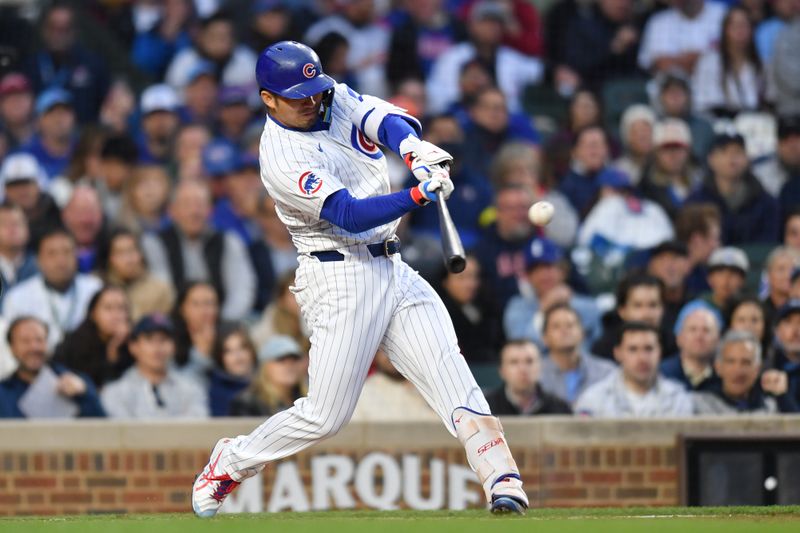 May 27, 2025; Chicago, Illinois, USA; Chicago Cubs designated hitter Seiya Suzuki (27) hits an RBI single during the third inning against the Colorado Rockies at Wrigley Field. Mandatory Credit: Patrick Gorski-Imagn Images