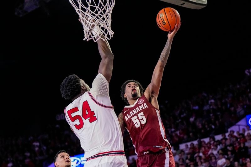 Jan 31, 2024; Athens, Georgia, USA; Alabama Crimson Tide guard Aaron Estrada (55) shoots over Georgia Bulldogs center Russel Tchewa (54) during the second half at Stegeman Coliseum. Mandatory Credit: Dale Zanine-USA TODAY Sports