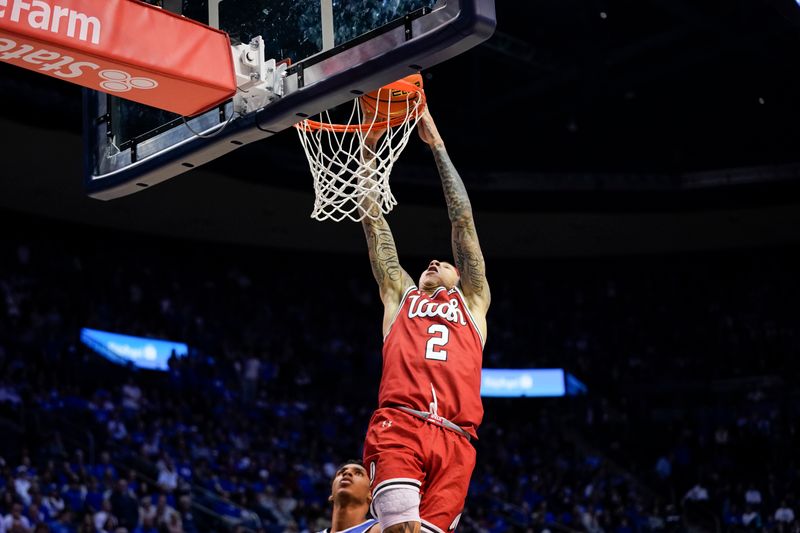 Jan 24, 2026; Provo, Utah, USA; Utah Utes guard Terrence Brown (2) dunks the ball during the second half against the BYU Cougars at Marriott Center. Mandatory Credit: Aaron Baker-Imagn Images 