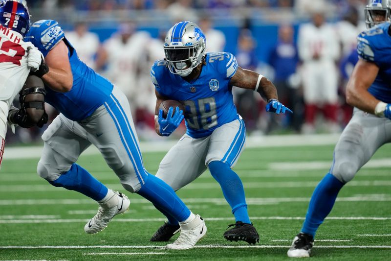 Detroit Lions running back Benny Snell (38) rushes during the second half of an NFL preseason football game against the New York Giants, Friday, Aug. 11, 2023, in Detroit. (AP Photo/Paul Sancya)