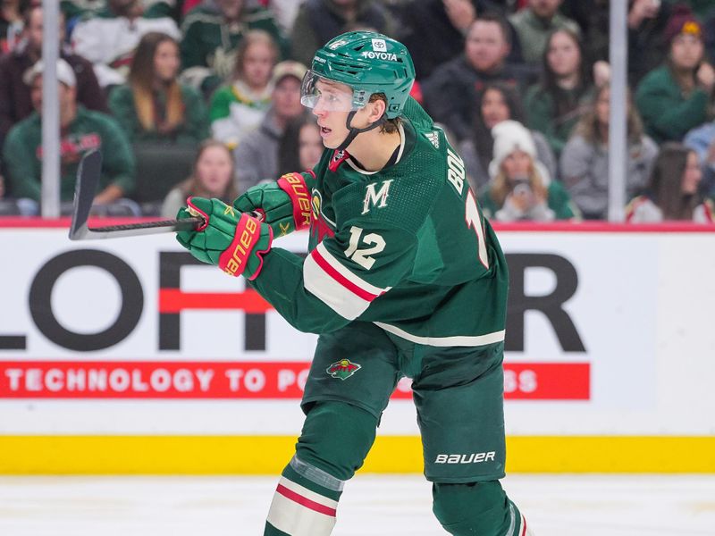 Apr 2, 2024; Saint Paul, Minnesota, USA; Minnesota Wild left wing Matt Boldy (12) scores against the Ottawa Senators in the second period at Xcel Energy Center. Mandatory Credit: Brad Rempel-USA TODAY Sports