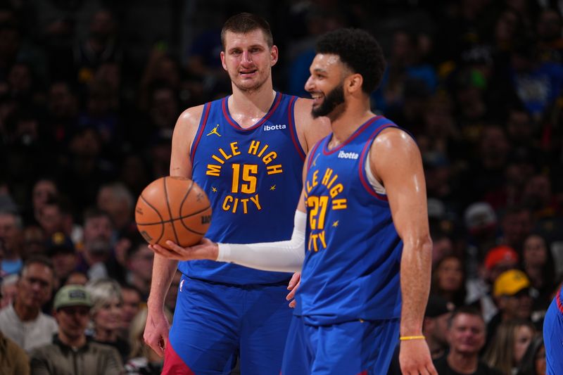 DENVER, CO - MARCH 5: Nikola Jokic #15 and Jamal Murray #27 of the Denver Nuggets smile during the game against the Phoenix Suns on March 5, 2024 at the Ball Arena in Denver, Colorado. NOTE TO USER: User expressly acknowledges and agrees that, by downloading and/or using this Photograph, user is consenting to the terms and conditions of the Getty Images License Agreement. Mandatory Copyright Notice: Copyright 2024 NBAE (Photo by Bart Young/NBAE via Getty Images)