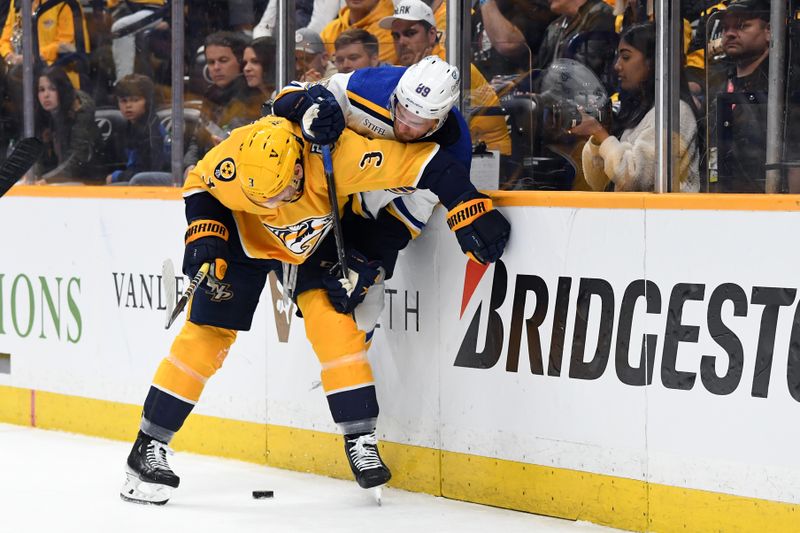 Apr 4, 2024; Nashville, Tennessee, USA; Nashville Predators defenseman Jeremy Lauzon (3) hits St. Louis Blues left wing Pavel Buchnevich (89) during the second period at Bridgestone Arena. Mandatory Credit: Christopher Hanewinckel-USA TODAY Sports