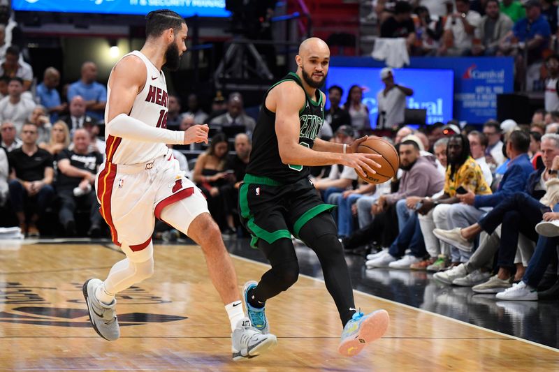 MIAMI, FL - APRIL 27: Derrick White #9 of the Boston Celtics dribbles the ball during the game against the Miami Heat during Round 1 Game 3 of the 2024 NBA Playoffs on April 27, 2024 at Kaseya Center in Miami, Florida. NOTE TO USER: User expressly acknowledges and agrees that, by downloading and or using this Photograph, user is consenting to the terms and conditions of the Getty Images License Agreement. Mandatory Copyright Notice: Copyright 2024 NBAE (Photo by Brian Babineau/NBAE via Getty Images)