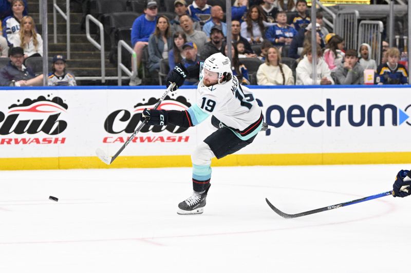 Apr 14, 2024; St. Louis, Missouri, USA; Seattle Kraken left wing Jared McCann (19) scores a goal against the St. Louis Blues during the first period at Enterprise Center. Mandatory Credit: Jeff Le-USA TODAY Sports