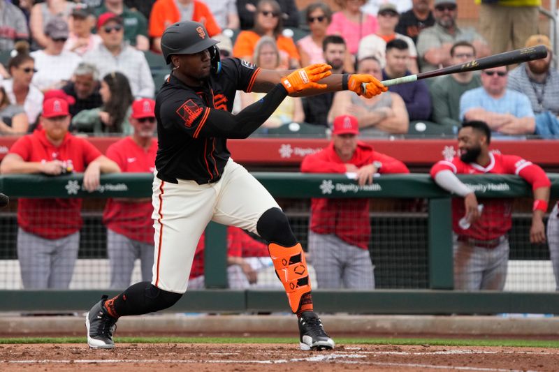 Feb 26, 2024; Scottsdale, Arizona, USA; San Francisco Giants outfielder Jorge Soler (2) hits a single against the Los Angeles Angels in the first inning at Scottsdale Stadium. Mandatory Credit: Rick Scuteri-USA TODAY Sports