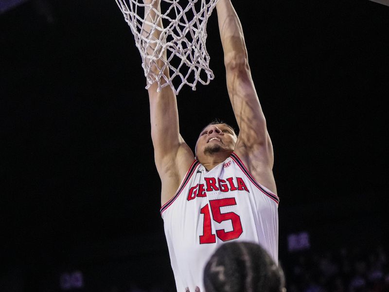 Jan 31, 2024; Athens, Georgia, USA; Georgia Bulldogs guard RJ Melendez (15) dunks against the Alabama Crimson Tide during the first half at Stegeman Coliseum. Mandatory Credit: Dale Zanine-USA TODAY Sports