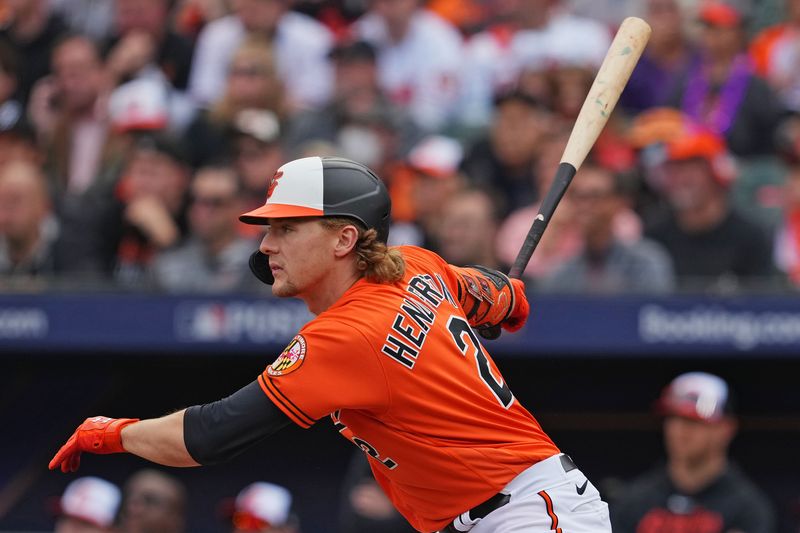 Oct 8, 2023; Baltimore, Maryland, USA; Baltimore Orioles third baseman Gunnar Henderson (2) hits a single during the first inning against the Texas Rangers during game two of the ALDS for the 2023 MLB playoffs at Oriole Park at Camden Yards. Mandatory Credit: Mitch Stringer-USA TODAY Sports