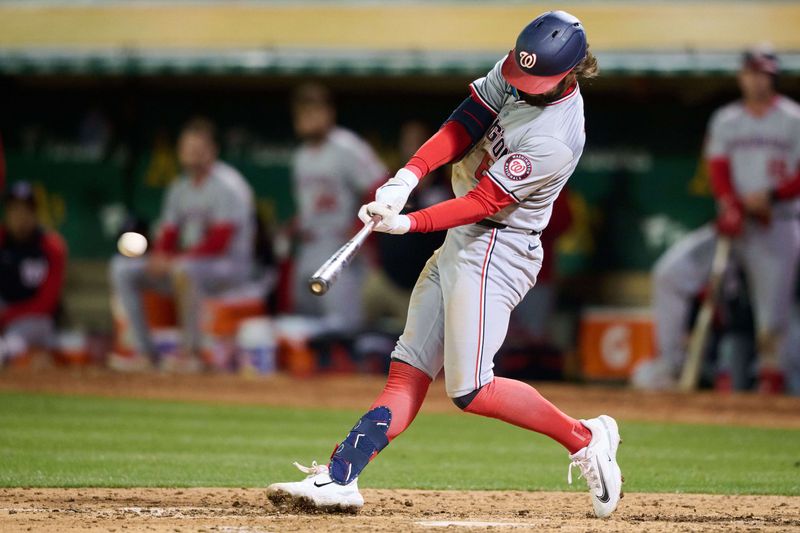 Apr 12, 2024; Oakland, California, USA; Washington Nationals outfielder Jesse Winker (6) bats against the Oakland Athletics during the sixth inning at Oakland-Alameda County Coliseum. Mandatory Credit: Robert Edwards-USA TODAY Sports