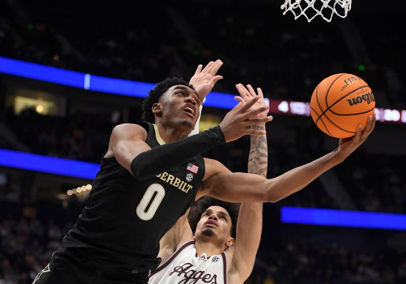 Mar 11, 2023; Nashville, TN, USA;  Vanderbilt Commodores guard Tyrin Lawrence (0) lays the ball in against the Texas A&M during the first half at Bridgestone Arena. Mandatory Credit: Steve Roberts-USA TODAY Sports