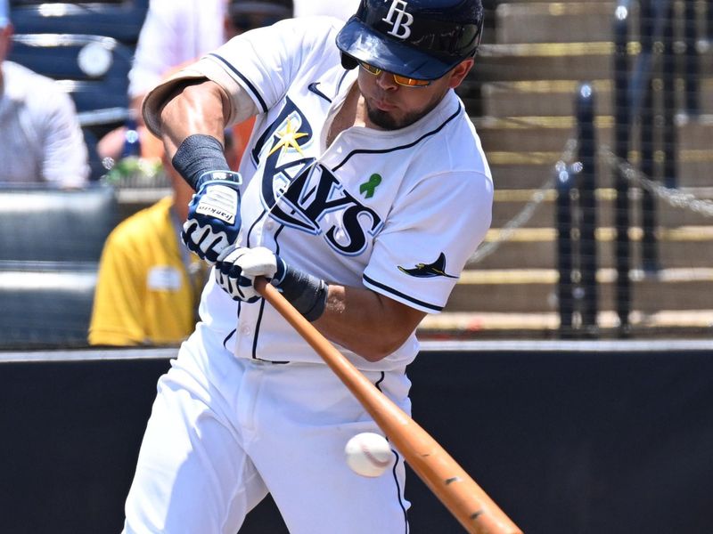 May 21, 2025; St. Petersburg, Florida, USA; Tampa Bay Rays first baseman Jonathan Aranda (62) hits a RBI single  in the first inning against the Houston Astros at George M. Steinbrenner Field. Mandatory Credit: Jonathan Dyer-Imagn Images