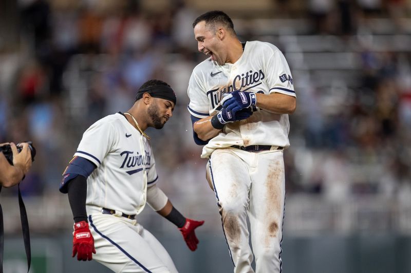 May 10, 2023; Minneapolis, Minnesota, USA; Minnesota Twins first baseman Alex Kirilloff (19) celebrates with Minnesota Twins left fielder Willi Castro (50) after hitting a walk off RBI single in the eleventh inning against the San Diego Padres at Target Field. Mandatory Credit: Jesse Johnson-USA TODAY Sports