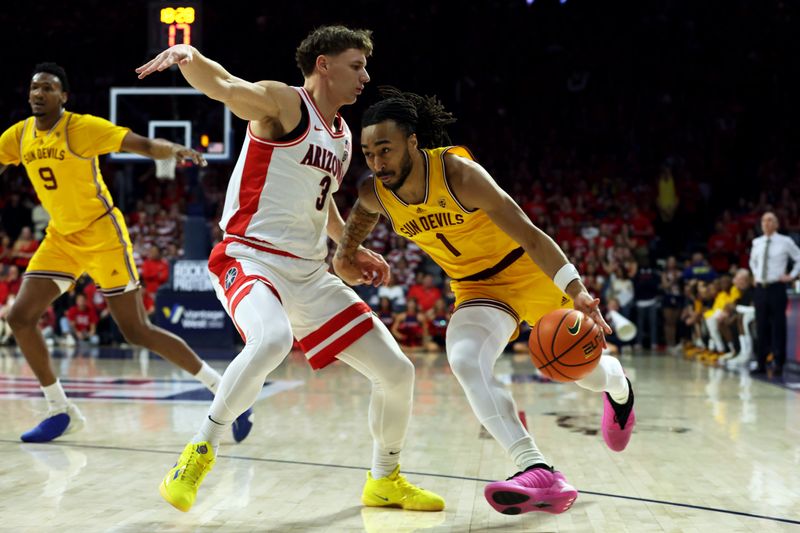 Feb 17, 2024; Tucson, Arizona, USA; Arizona State Sun Devils guard Frankie Collins (1) drives to the net against Arizona Wildcats guard Pelle Larsson (3) during the first half at McKale Center. Mandatory Credit: Zachary BonDurant-USA TODAY Sports