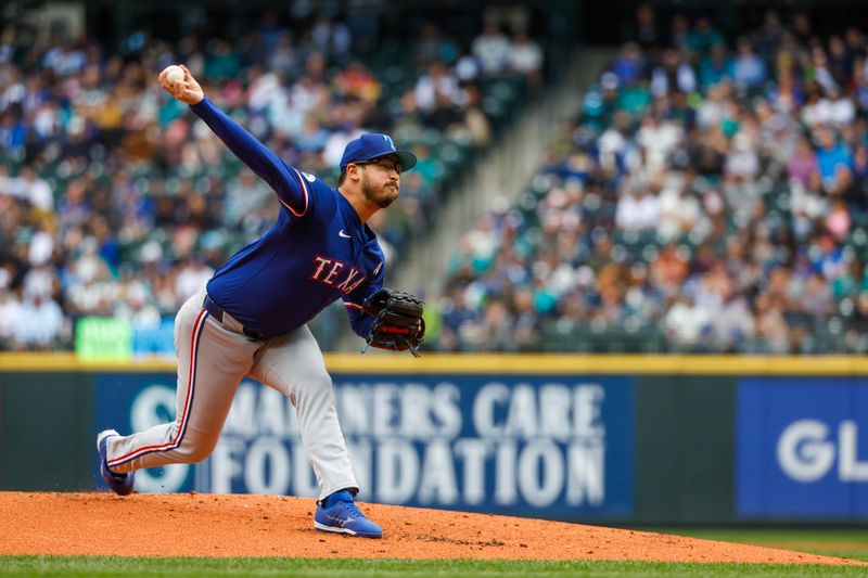 Jun 16, 2024; Seattle, Washington, USA; Texas Rangers starting pitcher Dane Dunning (33) throws against the Seattle Mariners during the first inning at T-Mobile Park. Mandatory Credit: Joe Nicholson-USA TODAY Sports