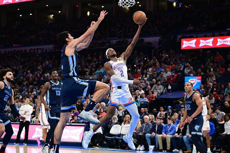 OKLAHOMA CITY, OKLAHOMA - DECEMBER 18: Shai Gilgeous-Alexander #2 of the Oklahoma City Thunder goes to the basket during the second half against the Memphis Grizzlies at Paycom Center on December 18, 2023 in Oklahoma City, Oklahoma. NOTE TO USER: User expressly acknowledges and agrees that, by downloading and or using this Photograph, user is consenting to the terms and conditions of the Getty Images License Agreement. (Photo by Joshua Gateley/Getty Images)