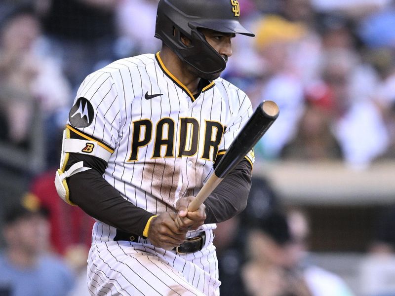 Sep 4, 2023; San Diego, California, USA; San Diego Padres center fielder Trent Grisham (1) hits a single against the Philadelphia Phillies during the sixth inning at Petco Park. Mandatory Credit: Orlando Ramirez-USA TODAY Sports