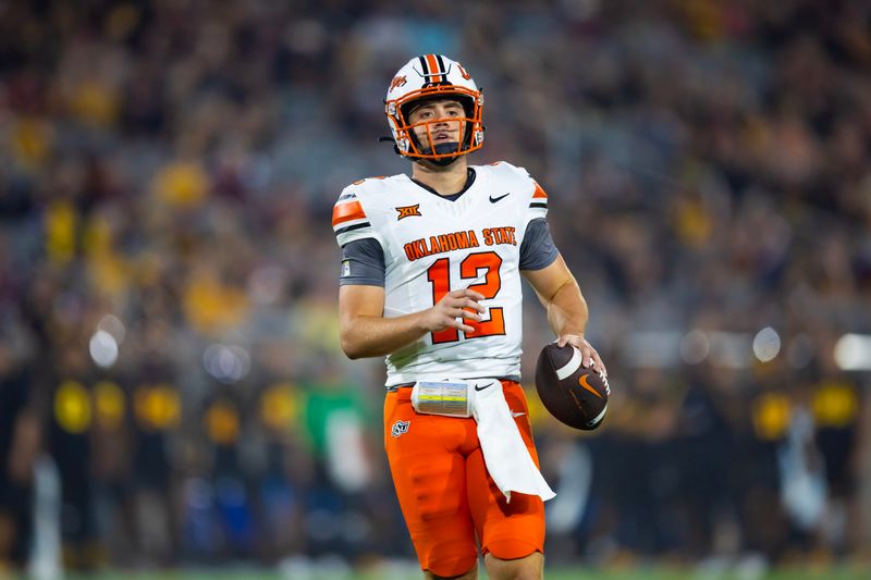 Sep 9, 2023; Tempe, Arizona, USA; Oklahoma State Cowboys quarterback Gunnar Gundy (12) against the Arizona State Sun Devils in the second half at Mountain America Stadium. Mandatory Credit: Mark J. Rebilas-USA TODAY Sports