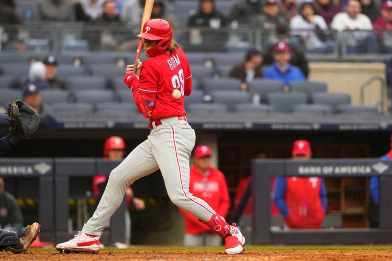 Apr 5, 2023; Bronx, New York, USA;  Philadelphia Phillies third baseman Alec Bohm (28) gets hit by a pitch during the seventh inning against the New York Yankees at Yankee Stadium. Mandatory Credit: Gregory Fisher-USA TODAY Sports