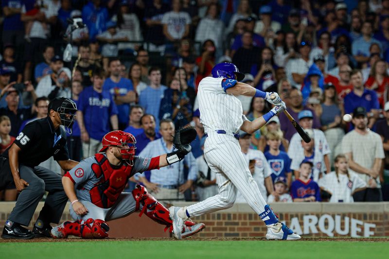 Aug 1, 2024; Chicago, Illinois, USA; Chicago Cubs outfielder Mike Tauchman (40) hits a walk-off single against the St. Louis Cardinals during the ninth inning at Wrigley Field. Mandatory Credit: Kamil Krzaczynski-USA TODAY Sports