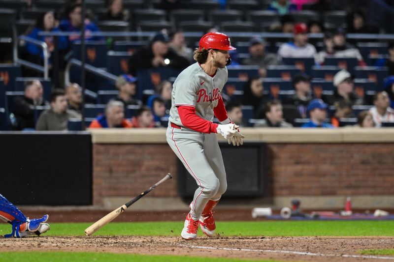 Apr 21, 2025; New York City, New York, USA; Philadelphia Phillies third baseman Alec Bohm (28) hits a single against the New York Mets during the ninth inning at Citi Field. Mandatory Credit: John Jones-Imagn Images