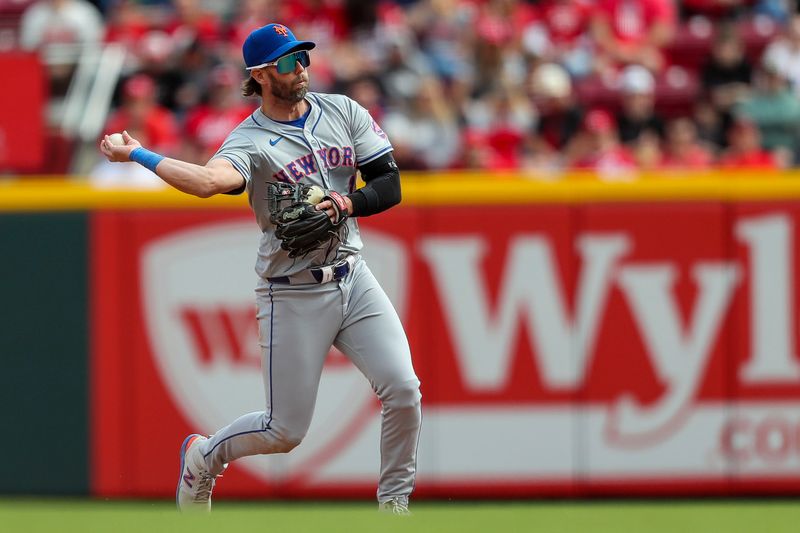 Apr 7, 2024; Cincinnati, Ohio, USA; New York Mets second baseman Jeff McNeil (1) throws to first to get Cincinnati Reds third baseman Jeimer Candelario (not pictured) out in the eighth inning at Great American Ball Park. Mandatory Credit: Katie Stratman-USA TODAY Sports