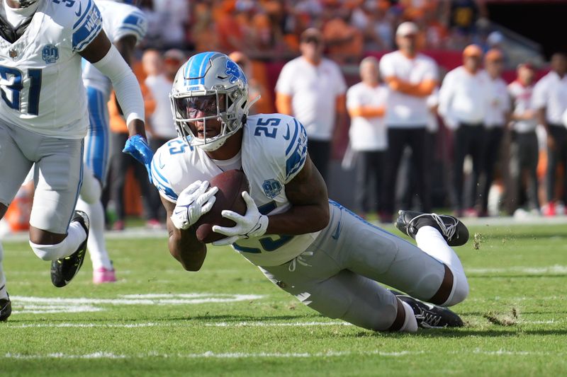 Detroit Lions cornerback Will Harris (25) intercepts a tipped pass in the first half during an NFL football game against the Tampa Bay Buccaneers, Sunday, Oct. 15 2023, in Tampa, Fla. (AP Photo/Peter Joneleit)