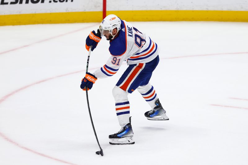 Feb 9, 2024; Anaheim, California, USA; Edmonton Oilers left wing Evander Kane (91) scores a goal during the third period of a game against the Anaheim Ducks at Honda Center. Mandatory Credit: Jessica Alcheh-USA TODAY Sports