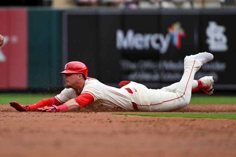 Apr 26, 2025; St. Louis, Missouri, USA;  St. Louis Cardinals designated hitter Nolan Gorman (16) slides in at second base for a double against the Milwaukee Brewers during the second inning at Busch Stadium. Mandatory Credit: Jeff Curry-Imagn Images