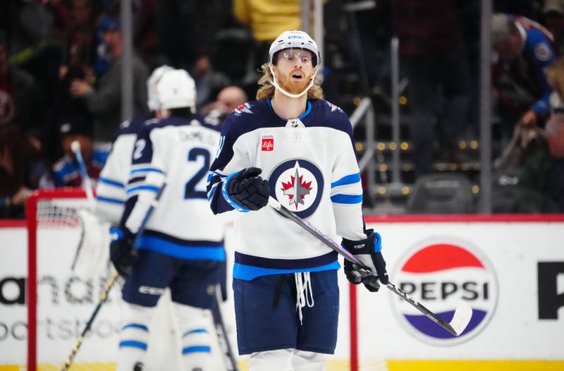 Dec 7, 2023; Denver, Colorado, USA; Winnipeg Jets left wing Kyle Connor (81) celebrates his goal in the third period against the Colorado Avalanche at Ball Arena. Mandatory Credit: Ron Chenoy-USA TODAY Sports