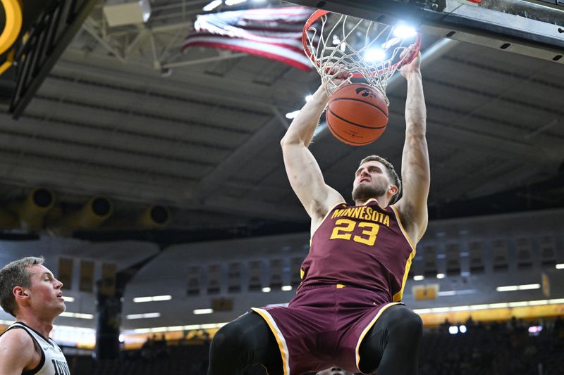 Feb 11, 2024; Iowa City, Iowa, USA; Minnesota Golden Gophers forward Parker Fox (23) dunks the ball against the Iowa Hawkeyes during the first half at Carver-Hawkeye Arena. Mandatory Credit: Jeffrey Becker-USA TODAY Sports