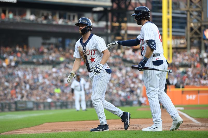 Jul 22, 2023; Detroit, Michigan, USA; Detroit Tigers catcher Jake Rogers (34) (left) celebrates with left fielder Matt Vierling (8) after scoring the second run on a two-run single from third baseman Zack Short (59) (not pictured) against the San Diego Padres in the second inning at Comerica Park. Mandatory Credit: Lon Horwedel-USA TODAY Sports