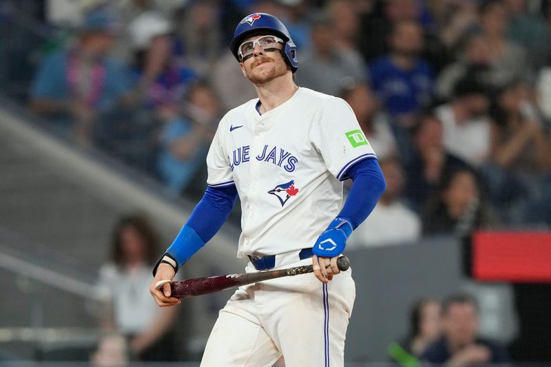 May 10, 2024; Toronto, Ontario, CAN; Toronto Blue Jays catcher Danny Jansen (9) reacts after striking out against the Minnesota Twins during the ninth inning at Rogers Centre. Mandatory Credit: John E. Sokolowski-USA TODAY Sports